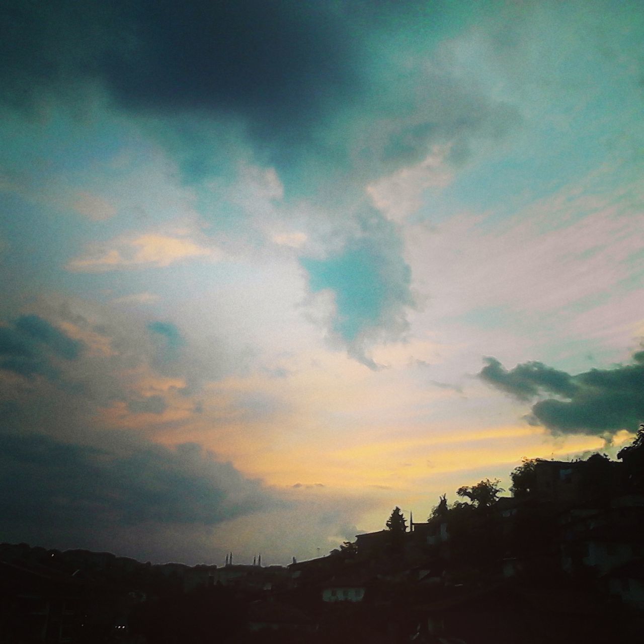 sunset, silhouette, sky, building exterior, built structure, cloud - sky, architecture, beauty in nature, scenics, tranquility, cloud, dusk, nature, tranquil scene, orange color, cloudy, house, tree, low angle view, outdoors