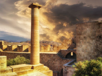 Castle against cloudy sky