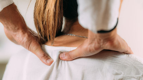 Woman enjoying shiatsu neck and shoulders massage.