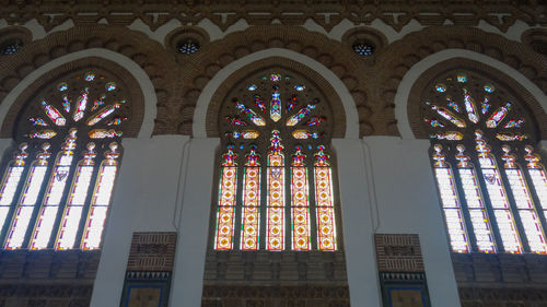 Low angle view of glass window of building