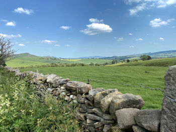 Landscape view, over a dry stone wall, of countryside high above, stirton, skipton, uk