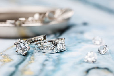 Close-up of wedding rings on table