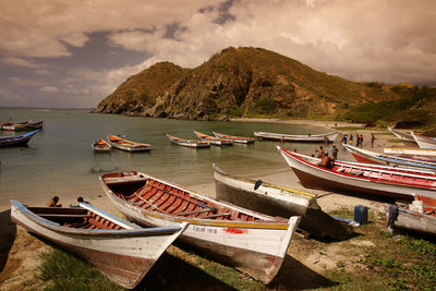 Boats moored in sea