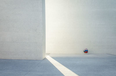 View of empty parking lot against wall