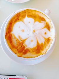 Close-up of cappuccino served on table