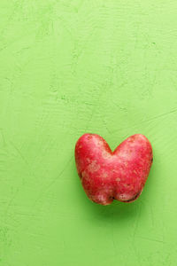 Close-up of red heart shape made of apple