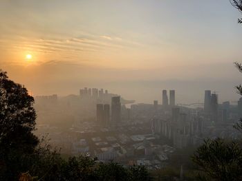 High angle view of buildings against sky during sunset