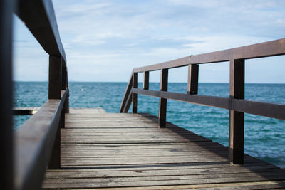 Pier over sea against sky