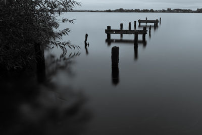 Gazebo in lake against sky