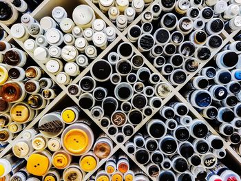 Full frame shot of buttons in bottles