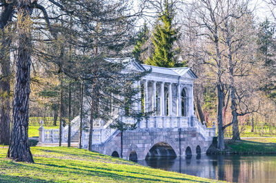 Bare trees in front of built structure