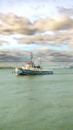 Boats in sea against sky