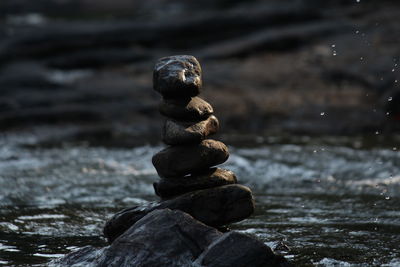 Close-up of stone stack on rock