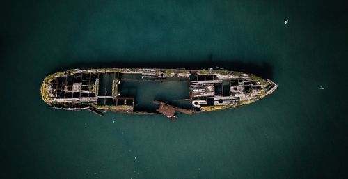 High angle view of buildings by sea