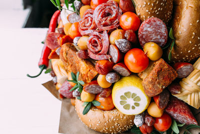 Delicious edible bouquet of sausage, tomatoes, cheese. gift for man.