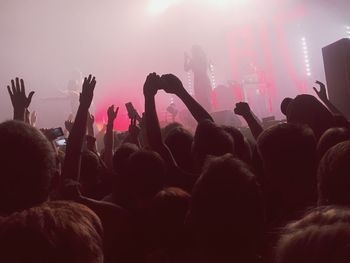 Low angle view of crowd enjoying in music concert