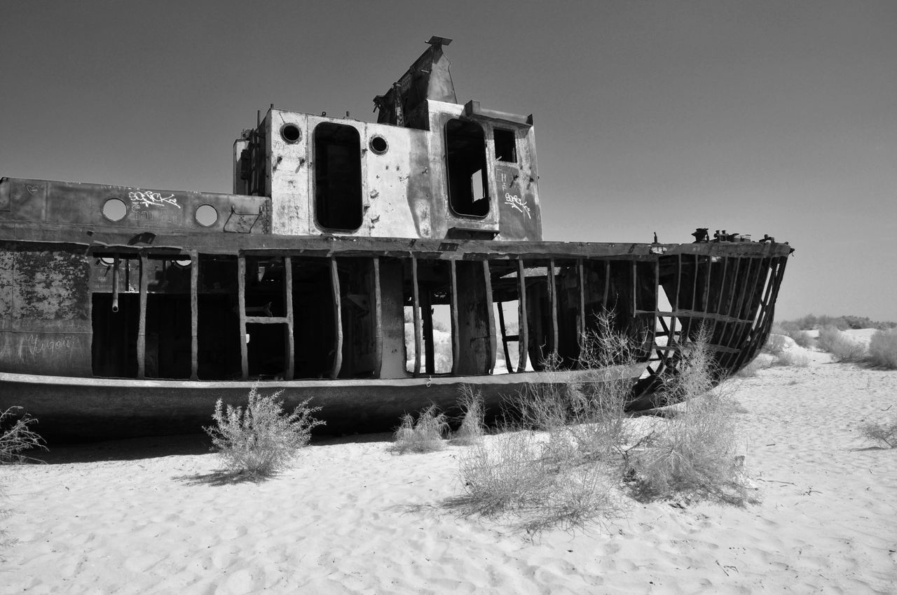 built structure, abandoned, architecture, obsolete, run-down, old, damaged, clear sky, deterioration, building exterior, water, wood - material, sky, nautical vessel, day, bad condition, ruined, no people, moored, weathered