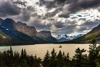 Scenic view of lake and mountains against sky