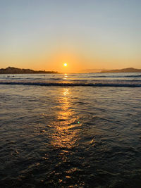 Scenic view of sea against sky during sunset