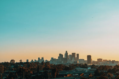 Cityscape against sky during sunset