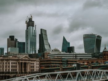 Modern buildings in city against sky