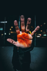 Close-up of hand with orange halloween