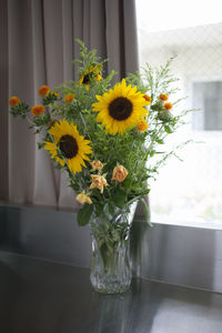 Close-up of sunflowers in vase on table