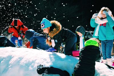 Young woman with umbrella at night