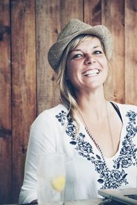 Portrait of smiling young woman wearing hat