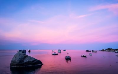 Scenic view of sea against romantic sky at sunset