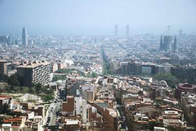 High angle view of modern buildings in city against sky