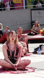 High angle view of people sitting on table