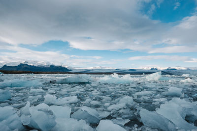 Scenic view of frozen lake against sky