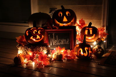 Illuminated jack o lanterns with welcome sign