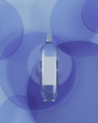 Close-up of light bulb against blue background