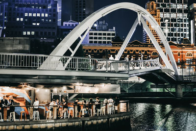 View of bridge over river in city