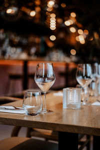 Close-up of wineglasses on table