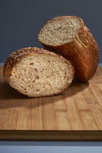 Close-up of bread on table against black background