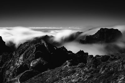 Scenic view of sea and rocks against sky