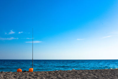 Scenic view of sea against blue sky