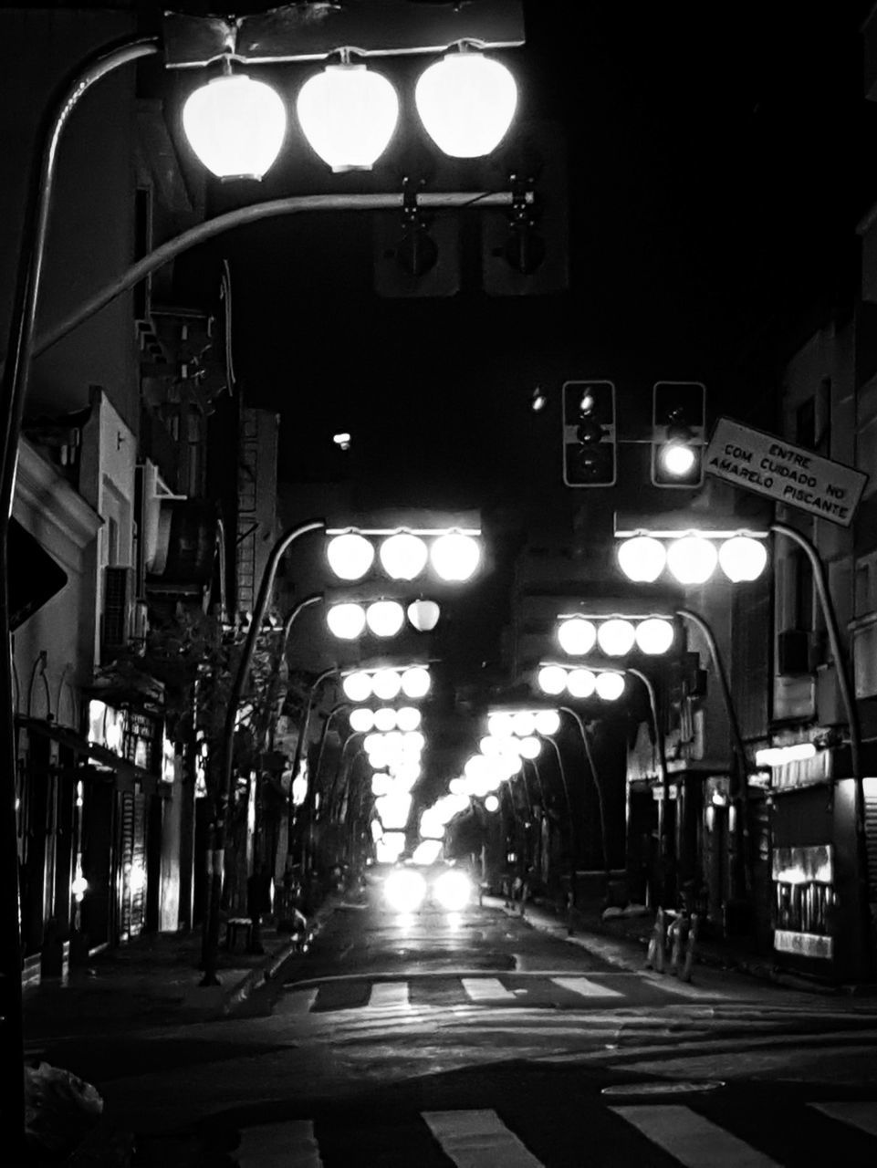 ILLUMINATED STREET LIGHTS AT NIGHT