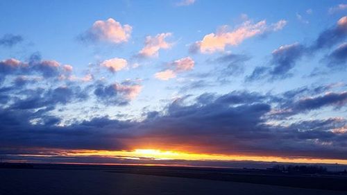 Scenic view of landscape at sunset