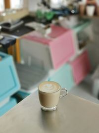 Close-up of coffee cup on table