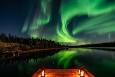 Scenic view of aurora polaris over lake at night