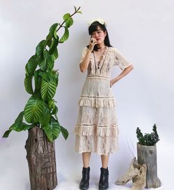 Woman standing against plants