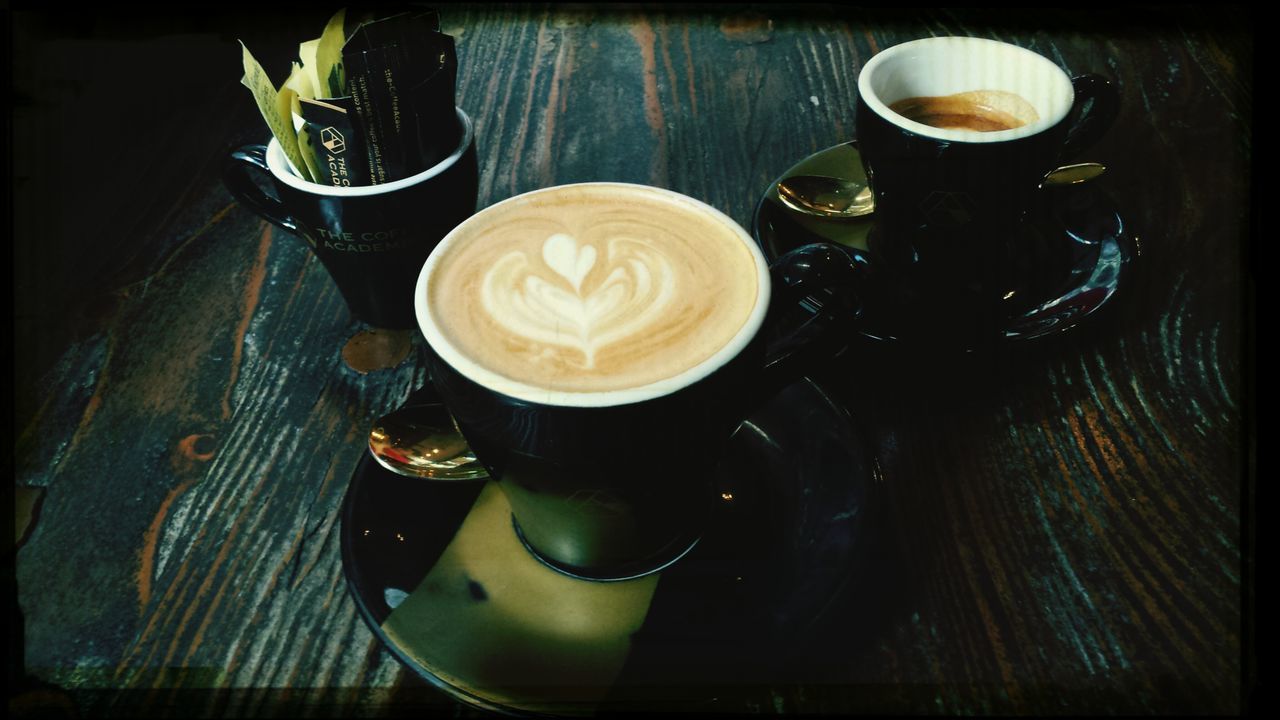 coffee cup, drink, food and drink, table, indoors, coffee - drink, refreshment, saucer, freshness, still life, high angle view, frothy drink, cappuccino, coffee, cup, close-up, spoon, transfer print, froth art, wood - material