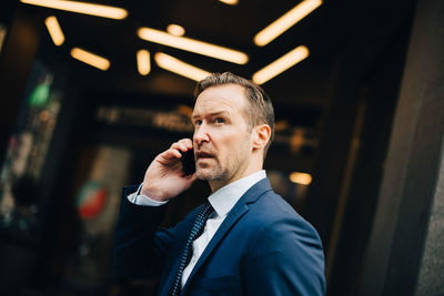 Portrait of man using mobile phone