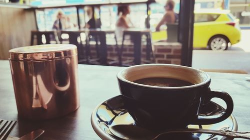 Close-up of coffee cup on table