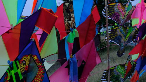 Low angle view of multi colored flags hanging