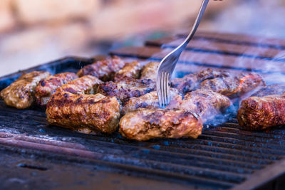 Close-up of meat on barbecue grill